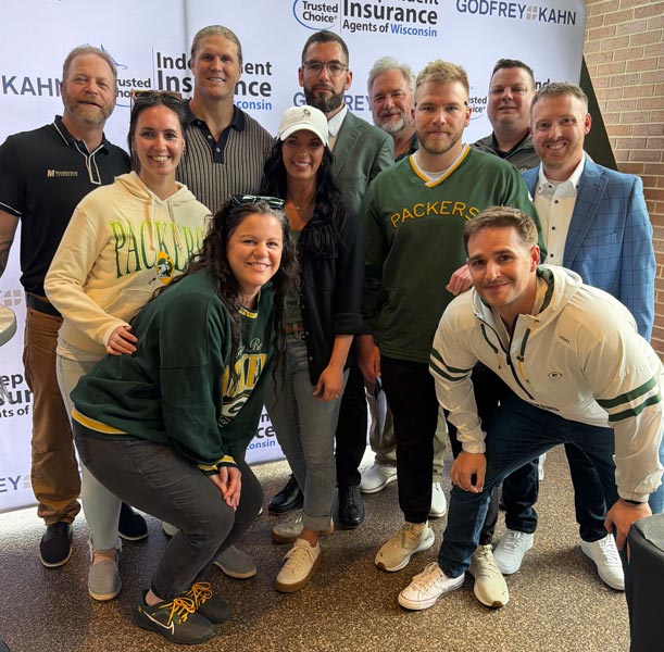 Marshfield Insurance team with Clay Matthews